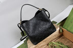 Gucci GG Emblem Medium Bucket Bag — Black GG Embossed Leather — Article 78