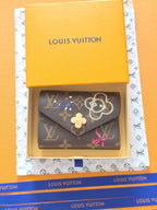 Louis Vuitton Victorine Wallet, Vivienne Winter Holiday — Catalogue 943175