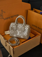 Louis Vuitton Speedy Bandoulière 20 — Tourterelle / Cream Monogram Empreinte — Article 1058